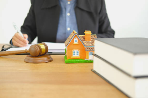istock businessman lawyer writing note organizing plan with notebook. buying selling renting real estate property 1078777212