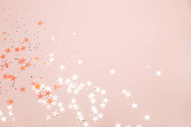 Heart with sparkles on Living Coral background.