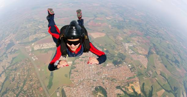 istock Empowered woman jumping from parachute. 1078779872