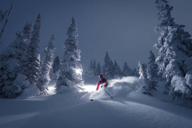 Skiing on a powder day Skiing in powder conditions. ski resort flash stock pictures, royalty-free photos & images