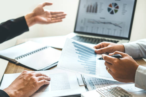 istock Co-working Business Team meeting Planning Strategy Analysis investment and saving concept. meeting discussing new plan financial graph data. 1078804786
