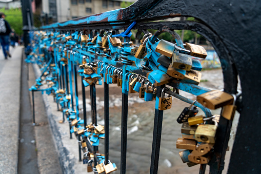 Love locks can be found all over Paris - seen here on a stone wall near Pont Saint-Michel