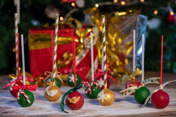 istock Various Christmas sweets and candies with christmas tree on wood table 1078838390