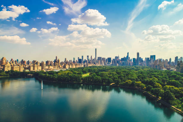 Aerial view of Central Park with Manhattan skyline Aerial view of Central Park with Manhattan skyline central park manhattan stock pictures, royalty-free photos & images