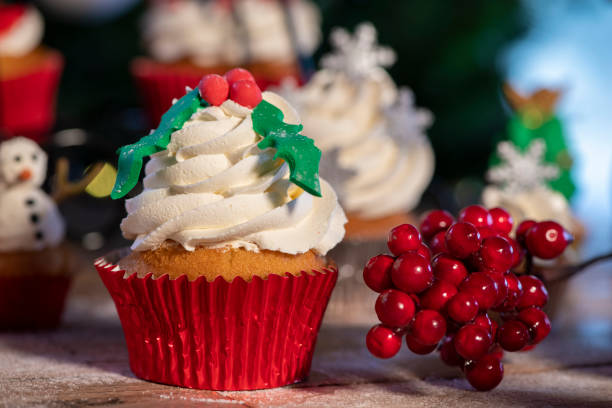 istock Various colorful Christmas cupcakes with christmas tree on wood table 1078850064