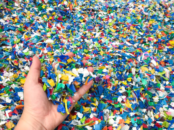 istock Hand holding Bottle flake,PET bottle flake,Plastic bottle crushed,Small pieces of cut colorful plastic bottles 1078856210