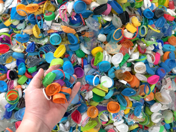 istock Hand holding plastic caps prepare for cut to PE flake 1078856902
