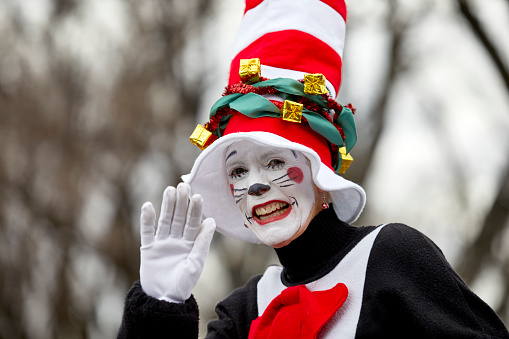 Prescott, Arizona, USA - December 1, 2018: Woman wearing a Cat in the Hat costume and waving while participating in the Christmas parade in downtown Prescott