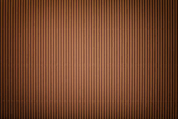 istock Texture of corrugated bronze paper with vignette, macro. 1078883642