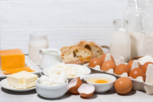 istock assortment of fresh dairy products on white table 1078896222