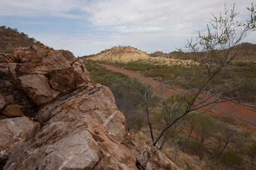 View from a high rocky ridge south of Mount Isa, Western Queensland, Australia, showing the road to Dajarra.