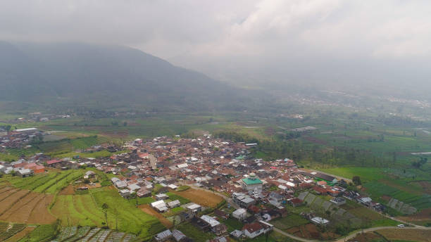 istock Mountain landscape farmlands and village Java Indonesia 1078915070