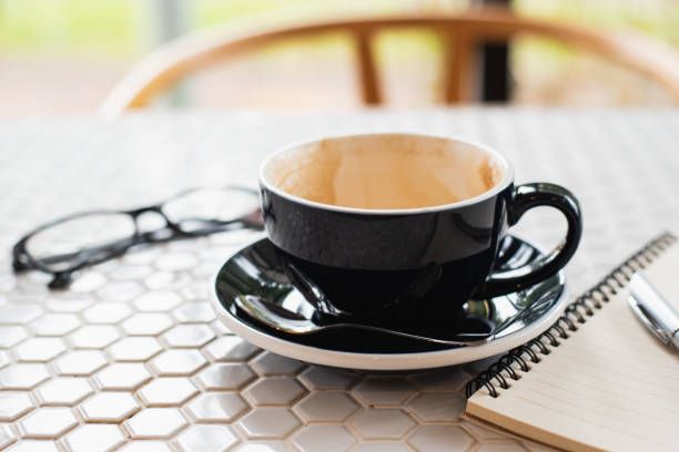 istock cup of coffee on white table 1078937420