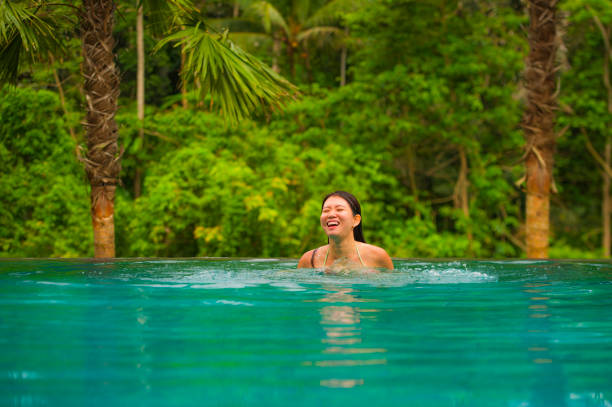istock Young Attractive Asian Woman Swimming 1078941264
