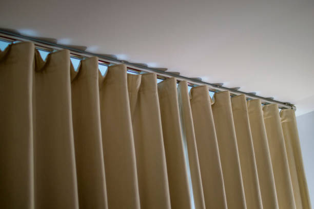 istock Yellowish curtain in home for windows 1078949496
