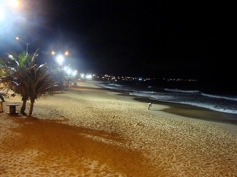 local girl by night at Ponta Negra beach, a famous beach in Natal, the capital city of Rio Grande do Norte in north eastern Brazil.