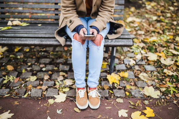 istock Young woman`s hands typing on smart phone 1078962150