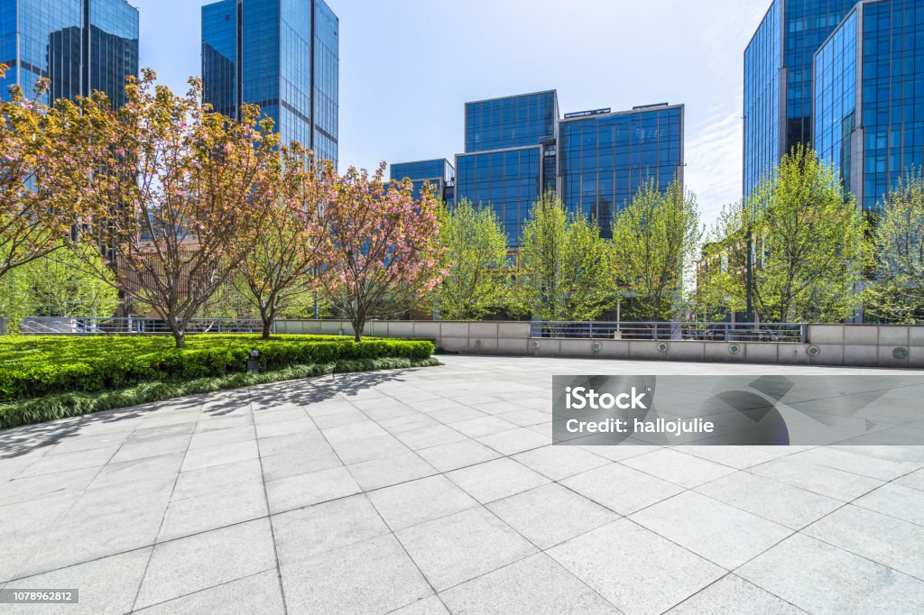 Empty Brick Floor With Modern Buildings Stock Photo - Download Image