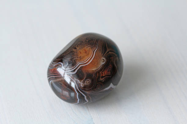 istock Agate. Natural round or oval stone agate with striped texture or pattern. A beautiful stone is agate 1078964570
