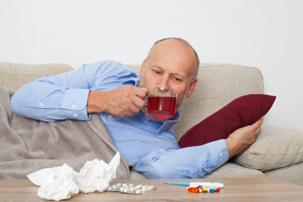 sick elderly man - painkiller thermometer tea prescription medicine imagens e fotografias de stock