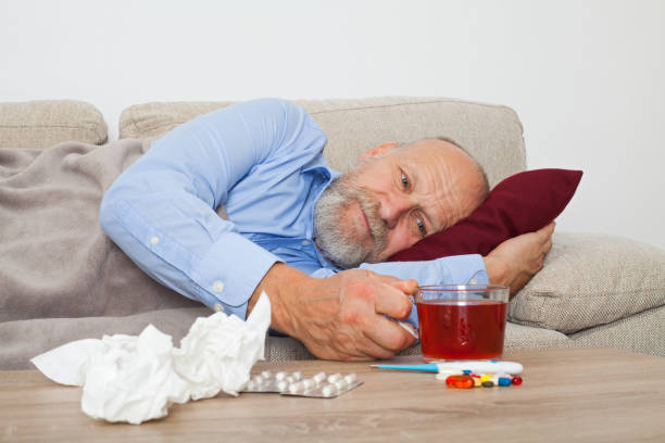 sick elderly man - painkiller thermometer tea prescription medicine imagens e fotografias de stock