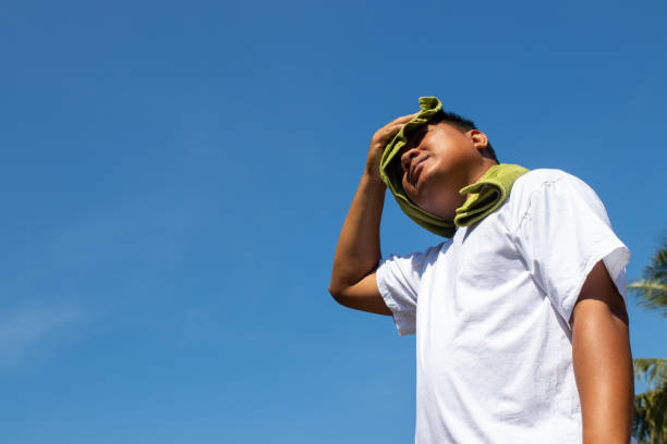 istock Young man and heat stroke. 1078969706