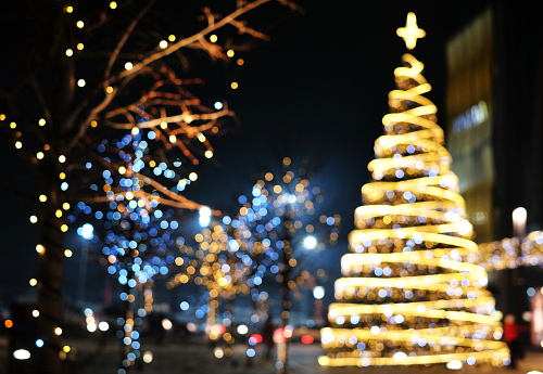 Christmas decoration background with golden and blue lights glowing.