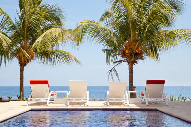 White sun loungers by the sea.
