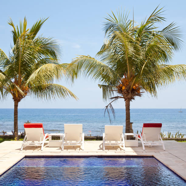 istock White sun loungers by the sea. 1078980264