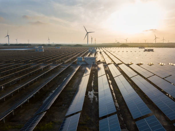 istock Solar panels and wind power, clean energy in nature 1078981358