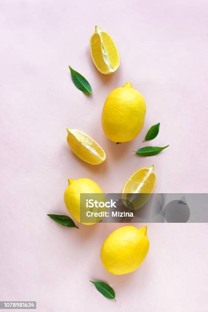 Lemons On Pink Stock Photo - Download Image Now - Lemon - Fruit, Flat Lay, Slice of Food