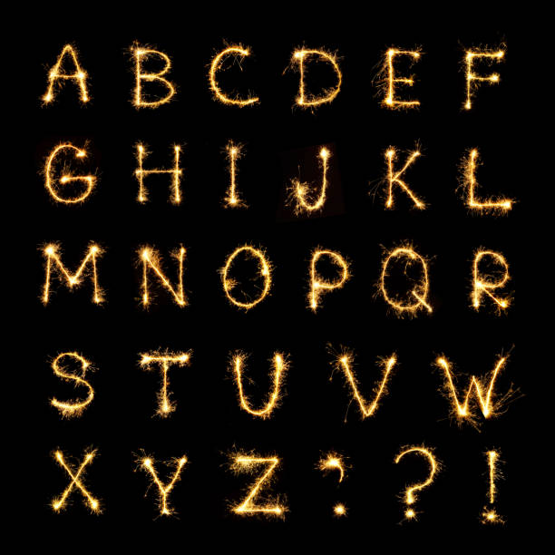 istock Burning sparkler letters isolated on black background 1078987056