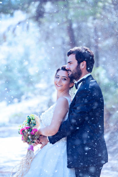 istock Young Wedding Couple on snow 1078987908