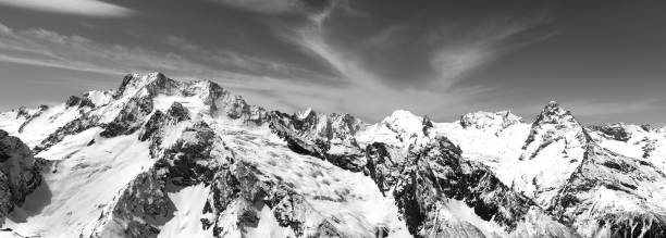 istock Black and white panorama of snowy mountains 1078991862