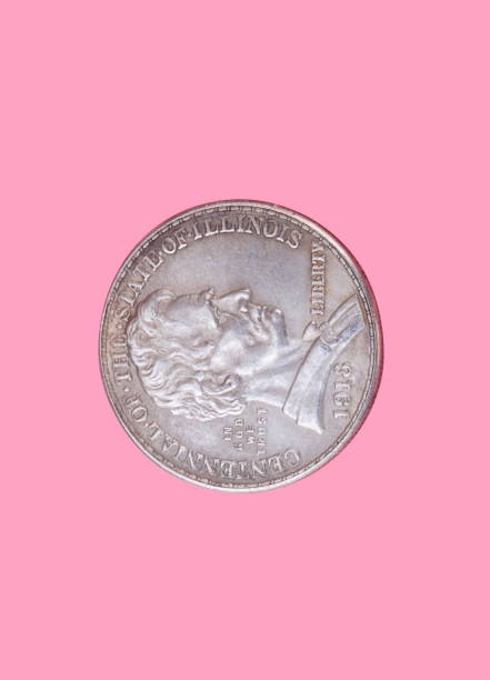 half dollar coin isolated on pink background