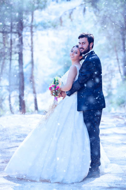 istock Young Wedding Couple on snow 1078999386