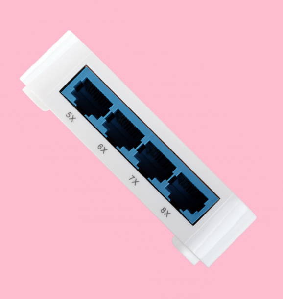 istock White 8 Port Plastic Ethernet Switch isolated on pink background at dry day 1079002072