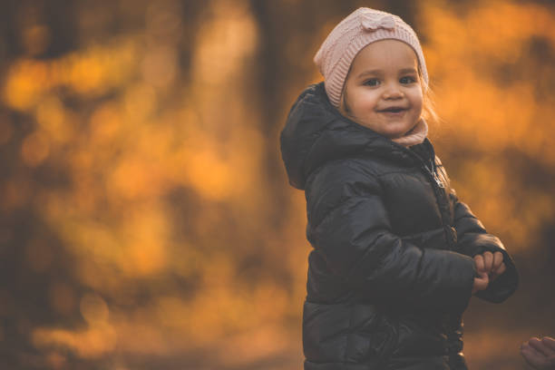 istock Girl playing outdoors in autumn 1079002986