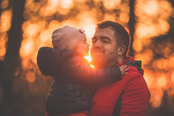 istock Daughter kissing her father 1079005380