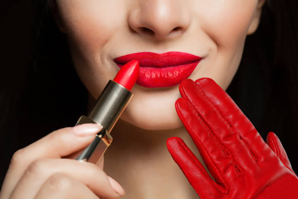 istock Red female lips with lipstick. Makeup and cosmetics concept 1079011114