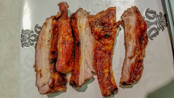 istock Rack of barbequed pork ribs ready to serve, cut 1079015880