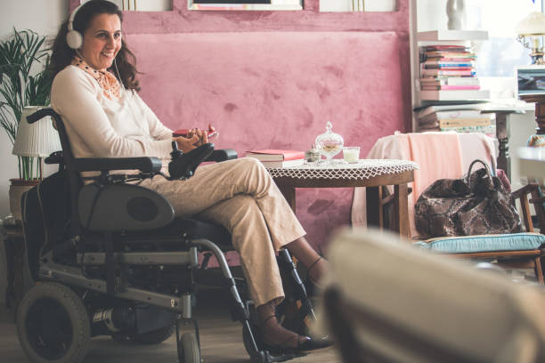 woman in wheelchair enjoying music - motorized wheelchair audio imagens e fotografias de stock