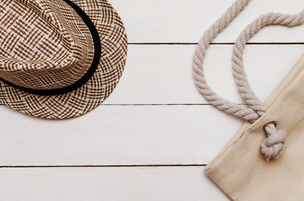 istock Hat and beach bag on a wooden table 1079031906