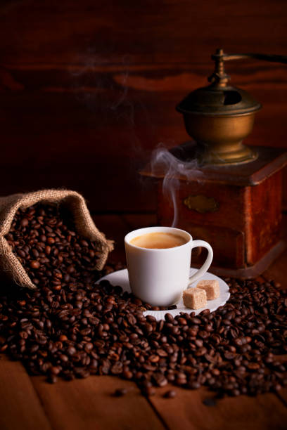 istock Cup of espresso coffee with coffee beans and old ginger 1079040210