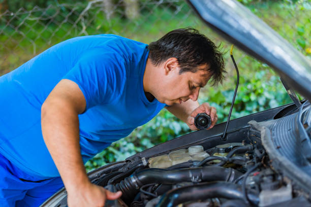 istock Man Repairing a Car Engine 1079047826