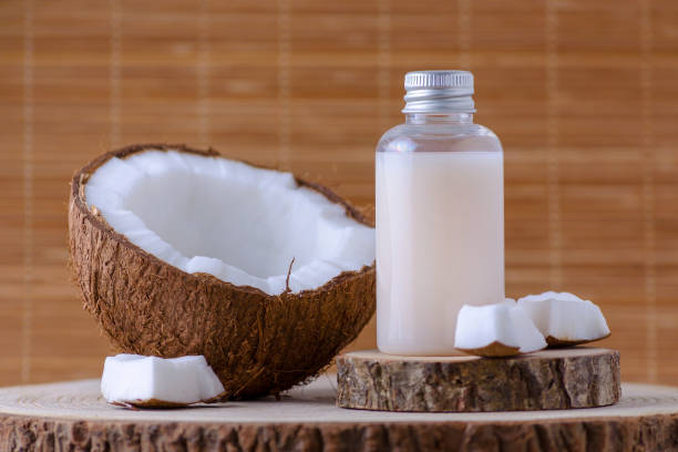 istock cosmetic bottle and fresh organic coconut , natural background 1079054082