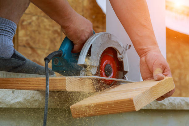 istock Building contractor worker using hand held worm drive circular saw to cut boards on a new home constructiion project 1079064138