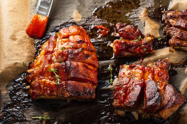 istock Grilled pork ribs on baking paper, top view. Copy space. 1079065746