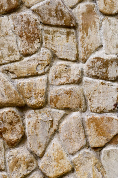 the brown texture of the masonry. background the brown texture of the masonry stone wall stone wall crag stock pictures, royalty-free photos & images