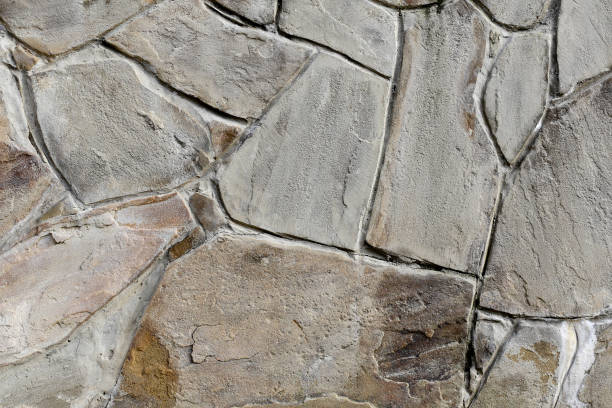 the brown texture of the masonry. background the brown texture of the masonry stone wall stone wall crag stock pictures, royalty-free photos & images